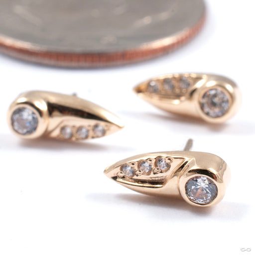 Centaura Press-fit End in Gold from Auris Jewellery in a group of yellow gold with cz