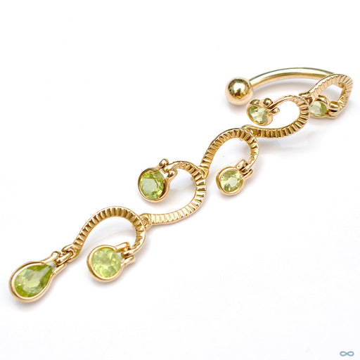 Waterfall Dangle Navel Curve in Yellow Gold with Peridot from BVLA with peridot