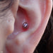 Conch piercing with Peony Press-fit End in Gold from Maya Jewelry in Clear CZ