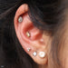 Outer helix piercing with Afghan Press-fit End in Gold from BVLA with Mercury Mist Topaz