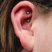 Rook piercing with Curved Press-fit Post with Side-set CZs in Titanium from NeoMetal in White Opal