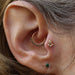 Tragus piercing with Mini Marquise Sarai Press-fit End in Gold from BVLA inMercury Mist Topaz & Clear CZ