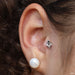 Tragus piercing with Mini Marquise Sarai Press-fit End in Gold from BVLA in Mystic Topaz & Clear CZ