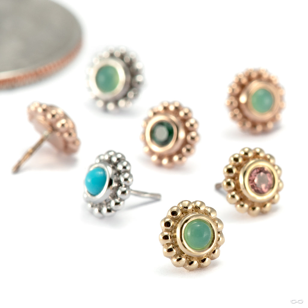Nose piercing jewelry in gold from BVLA with a center bezel-set stone