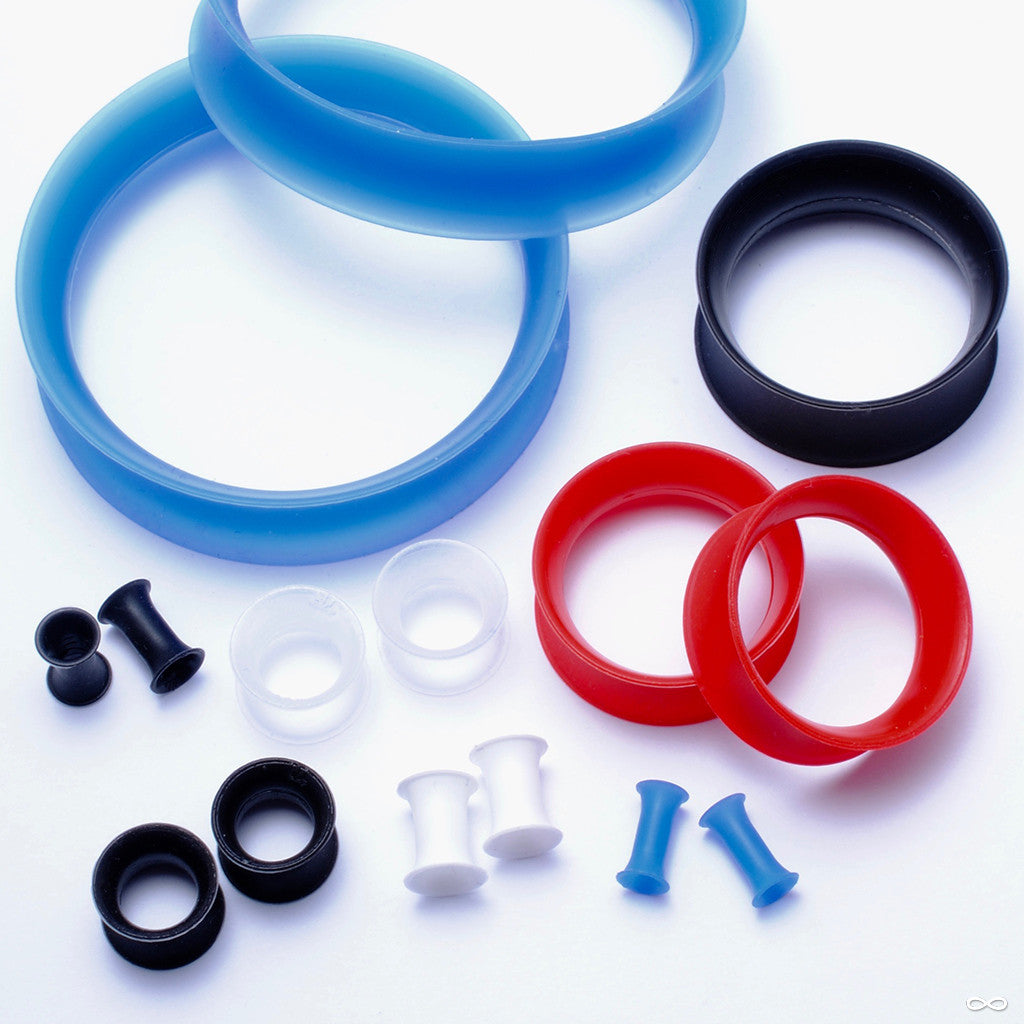 Collection of silicone plugs and eyelets from Kaos at Infinite Body Piercing