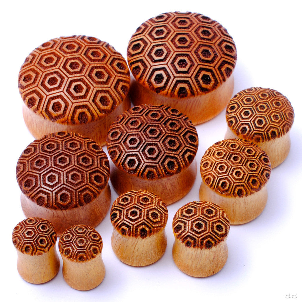 Turtle shell pattern wood ear plugs from Omerica at Infinite Body Piercing
