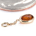 Bezel Oval Charm in 18k Yellow Gold with Hessonite Garnet from Diablo Organics side profile