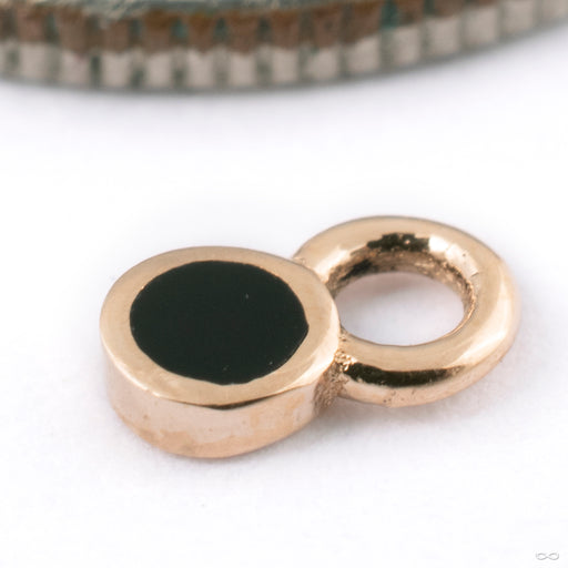 Bitty Polka Charm in Gold from Pupil Hall in 14k rose gold with black enamel