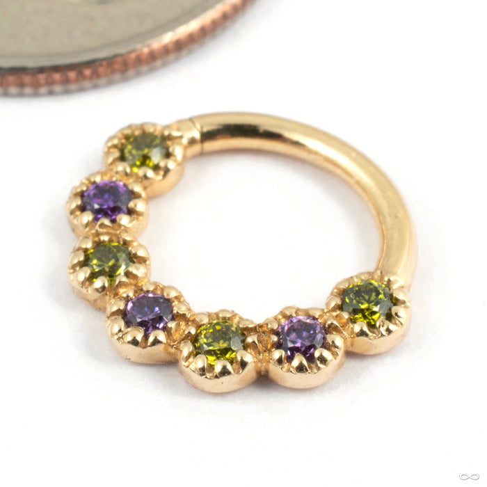 Daisy Chain Seam Ring in Gold from Tawapa in yellow gold with dark purple cz and peridot cz