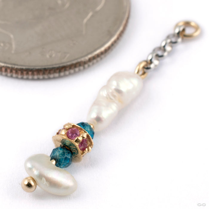 Interesting Charm in Gold from Pupil Hall in 14k yellow and white gold with white pearl, ruby, and blue topaz