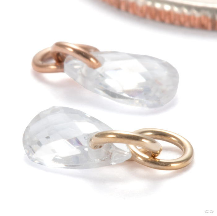 Linger Charm in Gold from Ember Body Jewelry in assorted materials