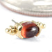 Sonnet Press-fit End in Gold from Quetzalli in yellow gold with garnet detail