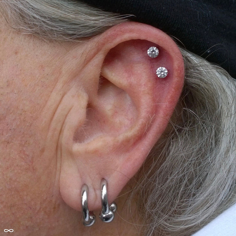 Outer helix piercings by Zach