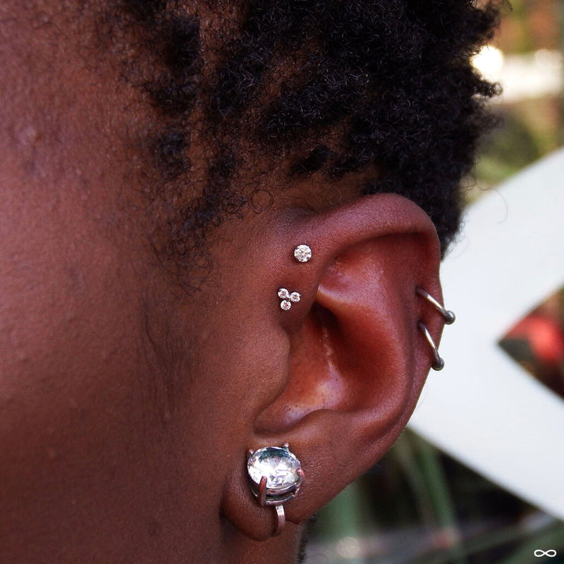 Double forward helix piercings by Robert