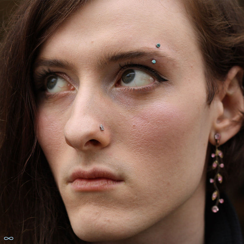 Eyebrow piercing by Andru