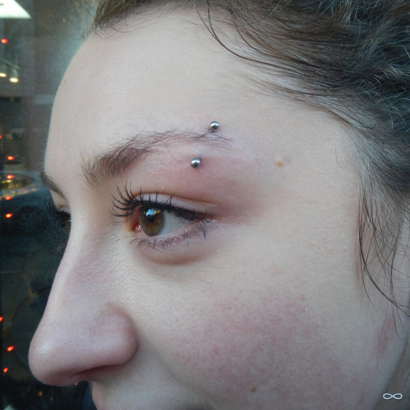 Eyebrow piercing by Ed