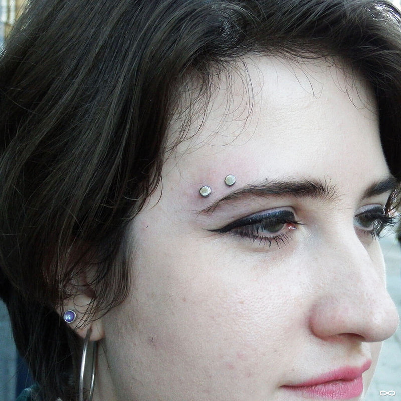 Surface Eyebrow piercing by Robert