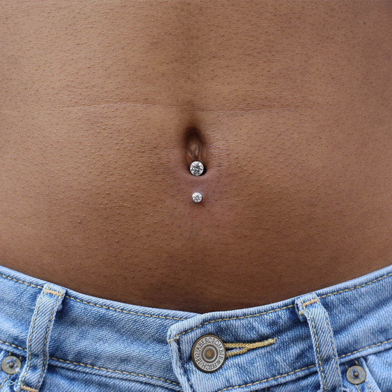 Lower navel piercing by Andru