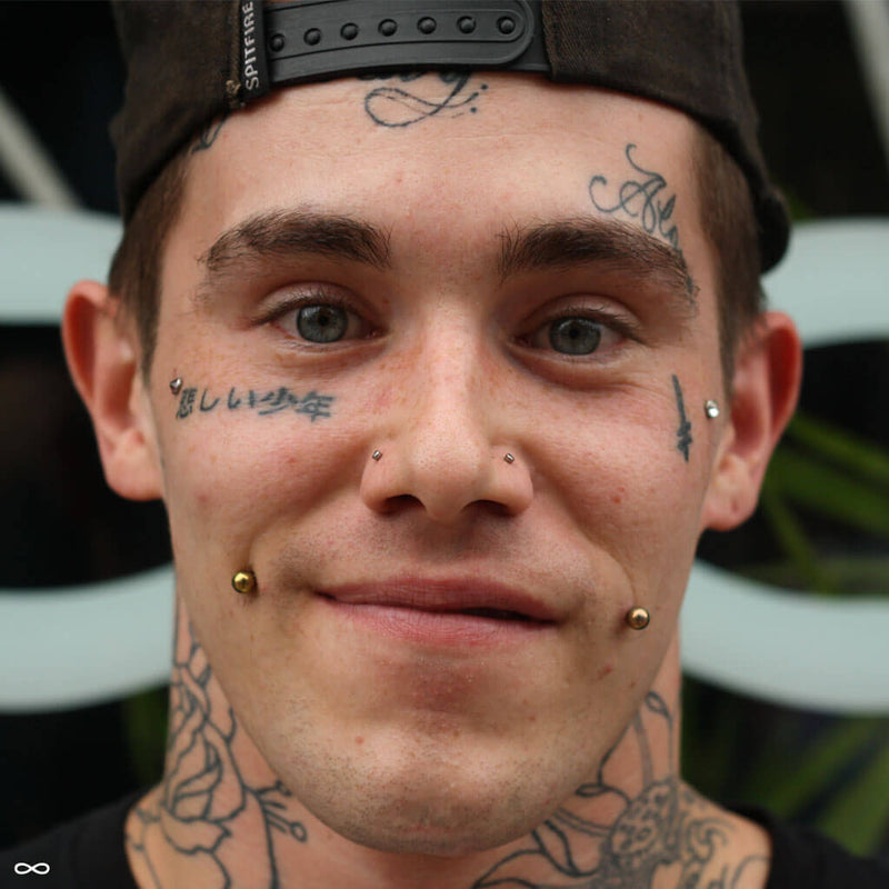 Cheek piercing by Andru
