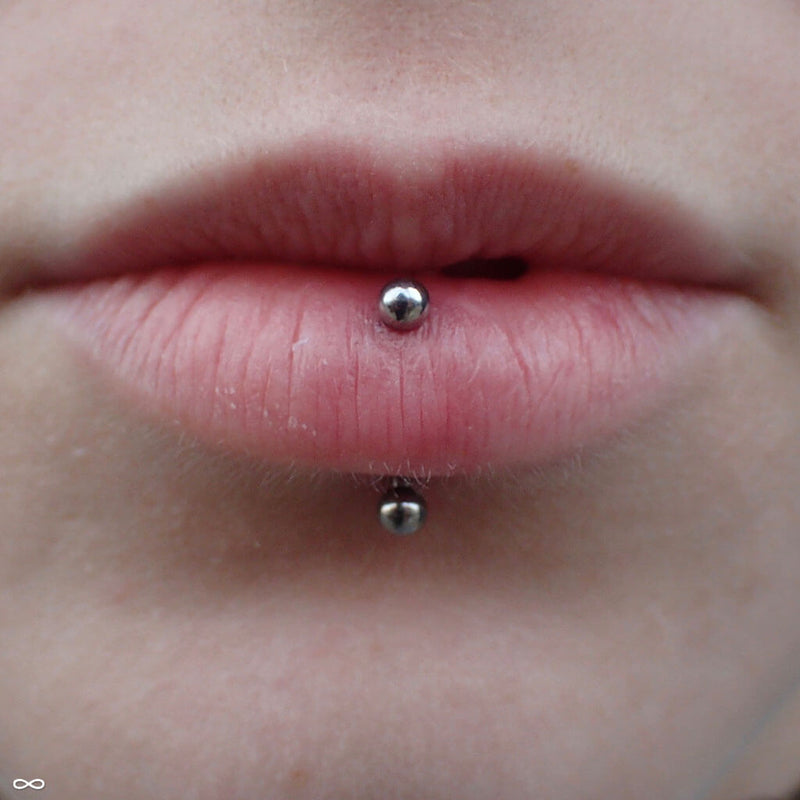 Vertical labret piercing by Zach