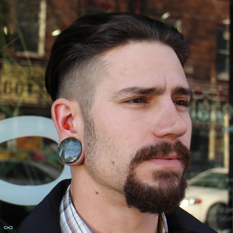 Large gauge conch piercing and stretched earlobe piercings