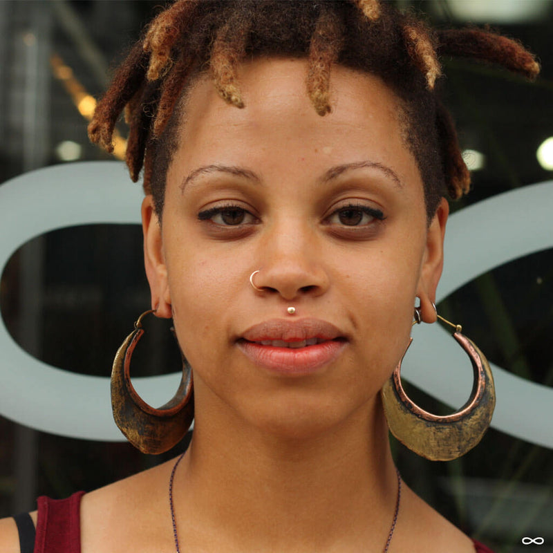 Stretched earlobe piercings with weights