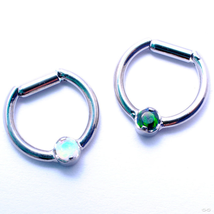 Hinged Ring with Prong-Set Gemstone in Titanium from Intrinsic with White Opal & Black Opal