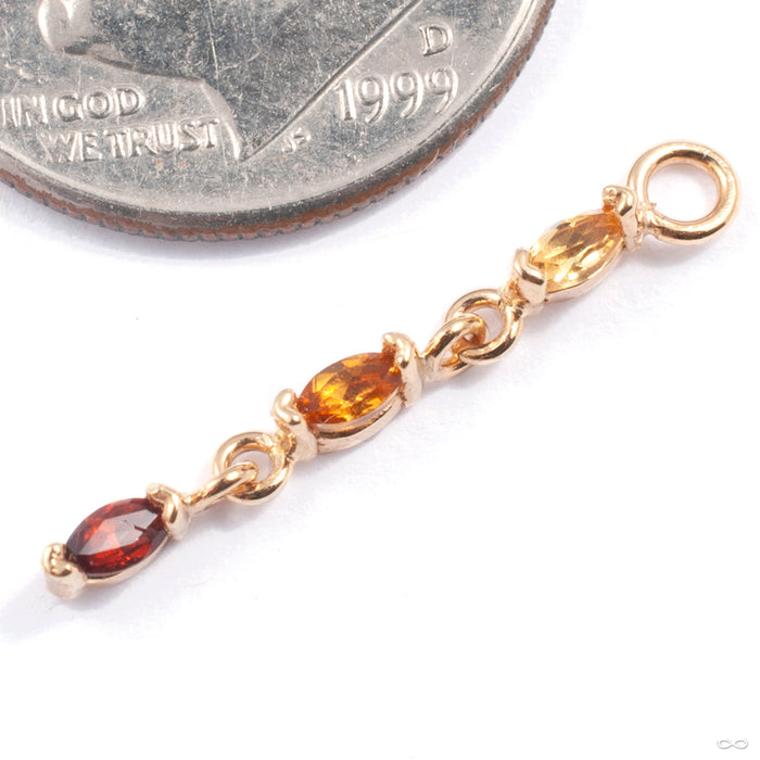 Adore Charm in Gold from Quetzalli in yellow gold with yellow sapphire citrine and garnet
