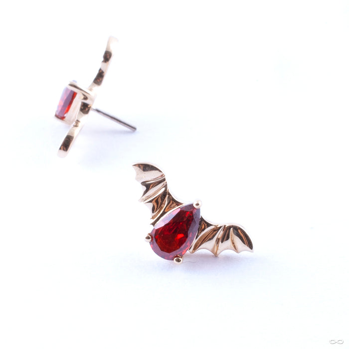 Bat with Stone Press-fit End in Gold from Junipurr Jewelry in yellow gold with red CZ