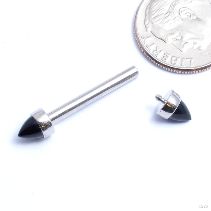 Bezel-set Bullet-cut Cabochon Threaded End in Stainless Steel from Anatometal with 4mm black onyx shown on a barbell