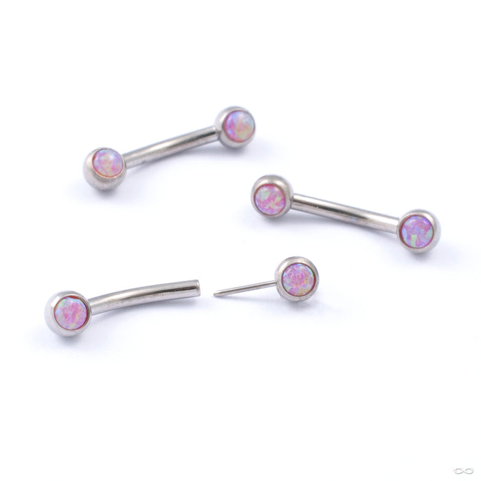 Curved Press-fit Post with Side-set Stones in Titanium from Neometal with bubblegum opal
