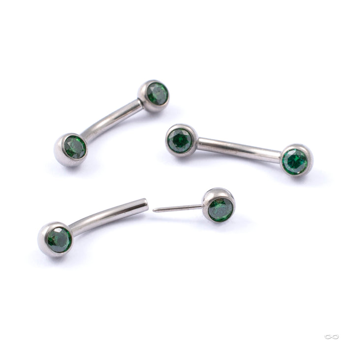 Curved Press-fit Post with Side-set Stones in Titanium from Neometal with emerald