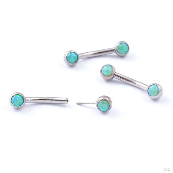 Curved Press-fit Post with Side-set Stones in Titanium from Neometal with lime opal