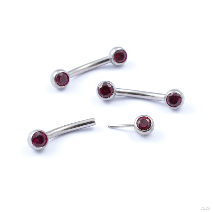 Curved Press-fit Post with Side-set Stones in Titanium from Neometal with ruby
