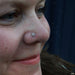Nostril piercing with Afghan Press-fit End in Gold from BVLA in Swiss Blue Topaz