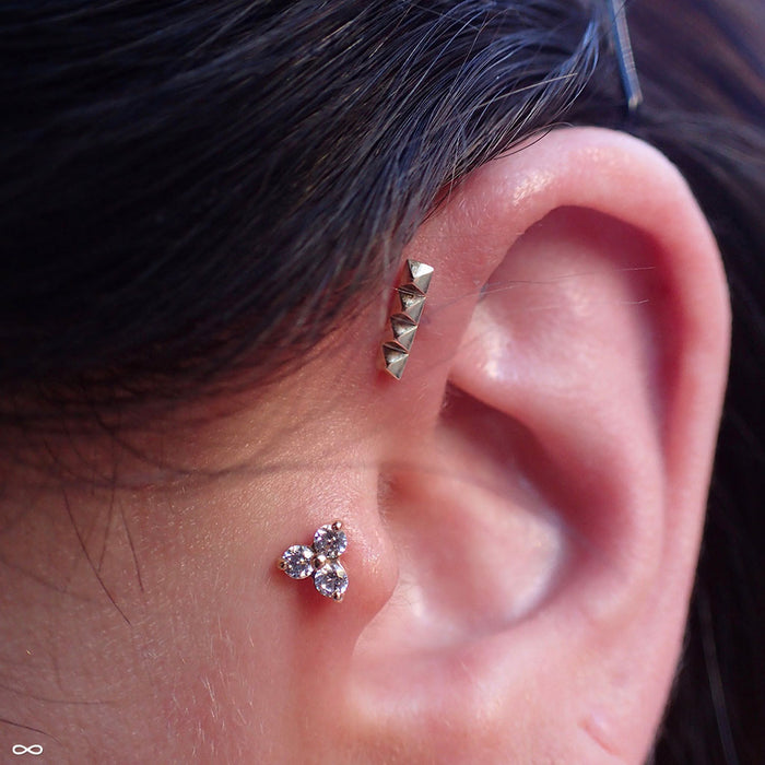 Pyramid Press-fit End in Gold from BVLA in a forward helix piercing