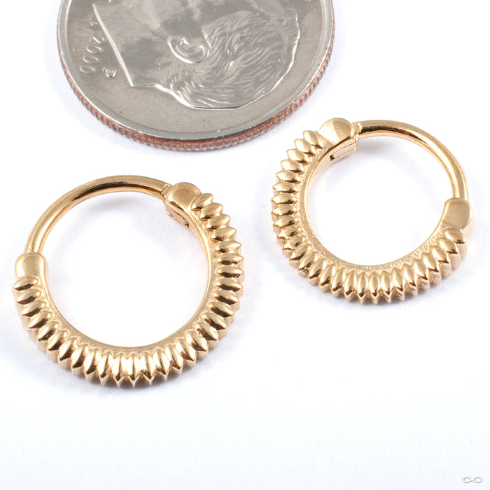 Giger Clicker from Tether Jewelry in various sizes in yellow gold