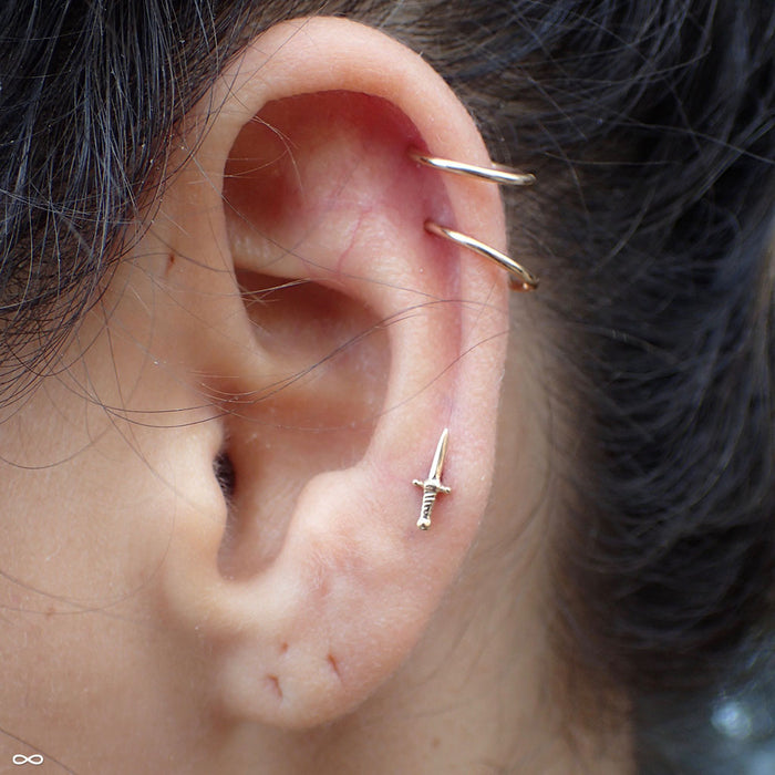 Lobe Piercing with Slasher Dagger Press-fit End in Yellow Gold from BVLA