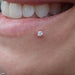 Lip piercing with Prong-set Gemstone Press-fit End in Gold from LeRoi in 2.5mm Clear CZ