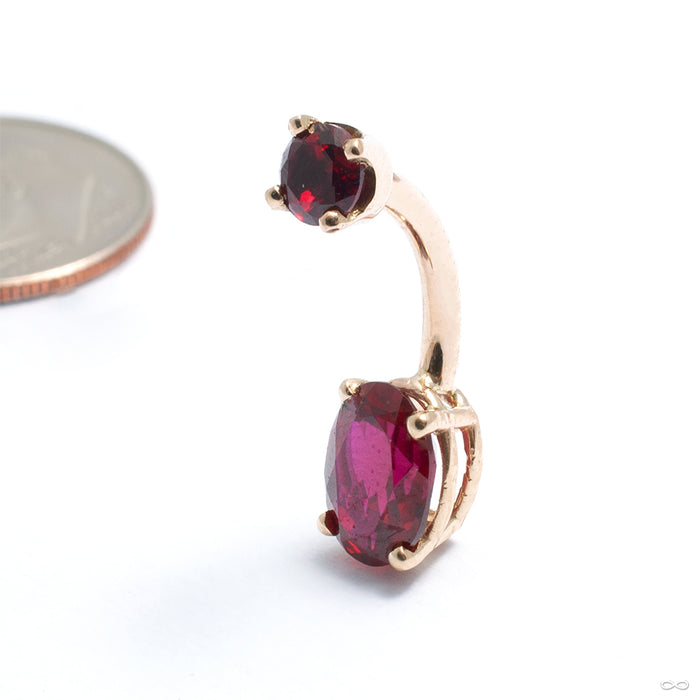 Prong-set Oval-cut Threaded Navel Curve in Gold from LeRoi with dark ruby