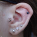 Moon Press-fit End in Gold from Anatometal in a tragus piercing