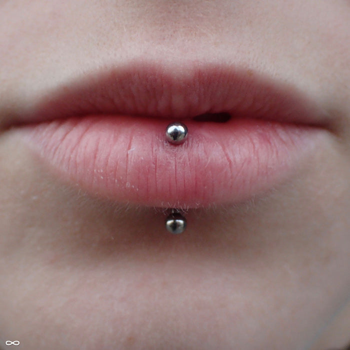 Vertical lip piercing with Curved Press-fit Post in Titanium from NeoMetal