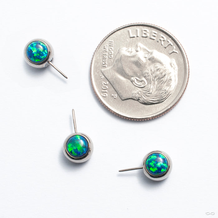 Side-set Cabochon Press-fit End in Titanium from NeoMetal with peacock opal