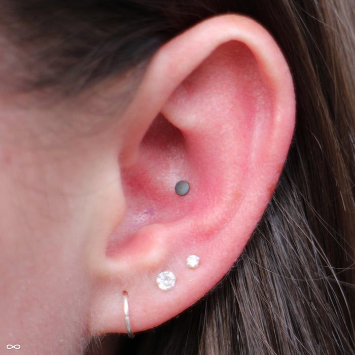 Conch Piercing with Brown Textured Disk Press-fit End in Titanium from NeoMetal