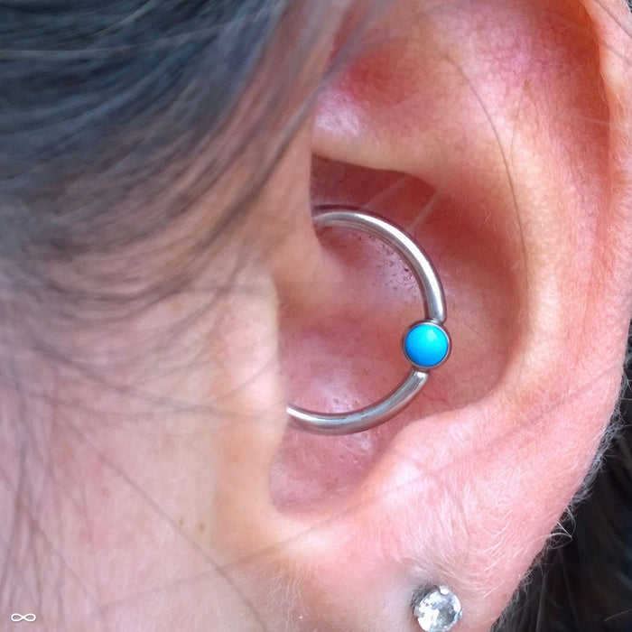 Daith piercing with Captive Gem Bead in Titanium from Industrial Strength in Turquoise