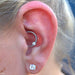 Daith piercing with Captive Gem Bead in Titanium from Industrial Strength in Clear CZ