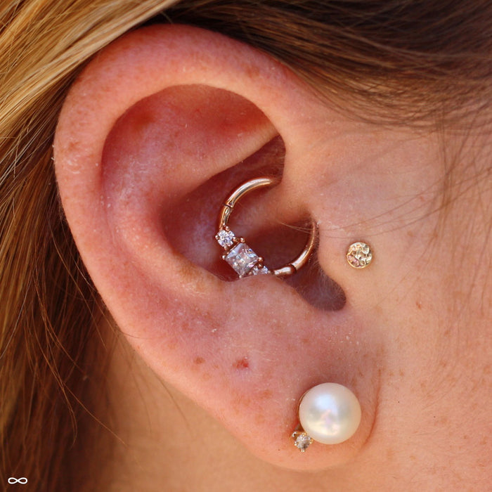 Daith piercing with Princess Clicker in Gold from Venus by Maria Tash in Clear CZ