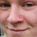 Nostril piercing with Ball Press-fit End in Titanium from NeoMetal in 3/32"