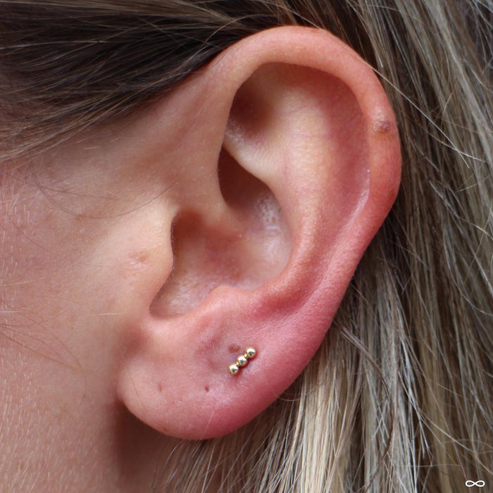 Lobe Piercing with Linear Tri Bead Press-fit End in Yellow Gold from BVLA
