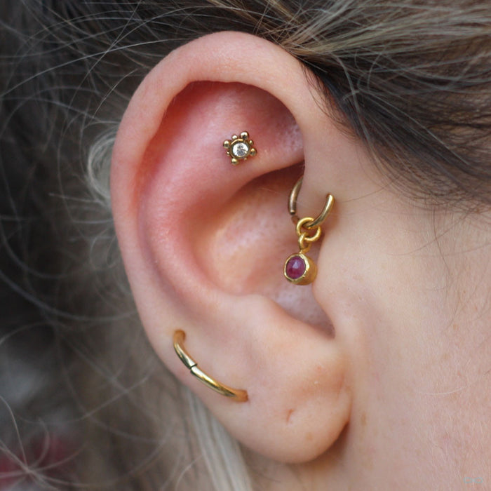 Outer Helix piercing with Bali Press-fit End in Gold from NeoMetal with Clear CZ